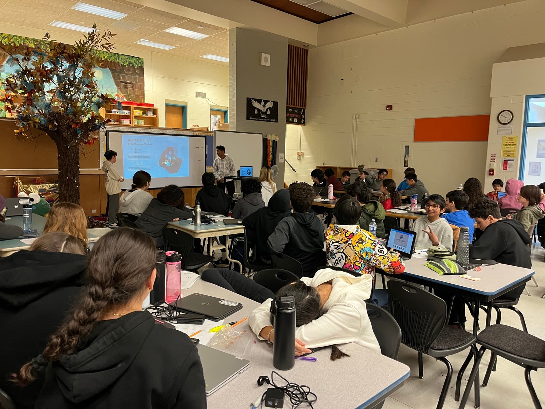 Students presenting a product idea to their classmates